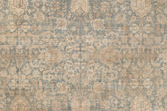 A detailed rug with an intricate floral and abstract pattern in shades of beige, cream, and light blue. The design features symmetrical motifs, including flowers and ornate curvilinear shapes, giving it a classic, antique appearance befitting heirloom rugs. This is the KERMAN RUG, SOUTH EAST PERSIA, 10' 8" X 14' 8" from Ben Soleimani.