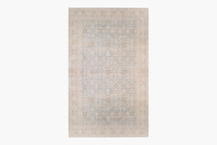 A rectangular TABRIZ RUG, NORTH WEST PERSIA, 11' X 14' with an intricate, symmetrical pattern of geometric shapes and floral motifs. The rug, reminiscent of Ben Soleimani's heirloom-quality pieces, features a muted color palette primarily comprising soft blues, beige, and light brown tones, creating an elegant and subtle design.