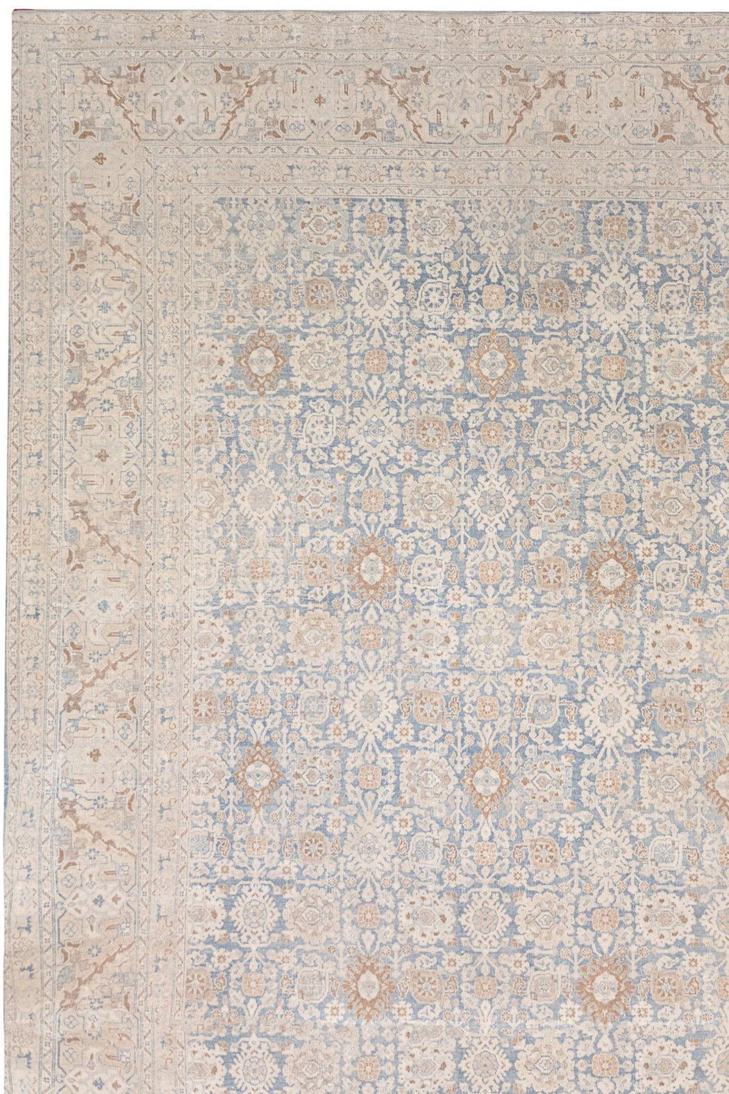 A detailed rug with an intricate floral and geometric pattern in shades of beige, light blue, and cream. Reminiscent of antique rugs, this Ben Soleimani TABRIZ RUG, NORTH WEST PERSIA, 11' X 14' design features a border framing a central field with repeating motifs, giving it an ornate and elegant appearance that's heirloom-quality.